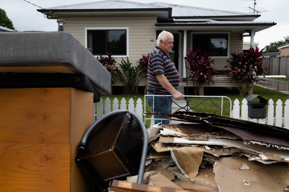 Robert Graham surveys his waterlogged possessions in Mullumbimby. 