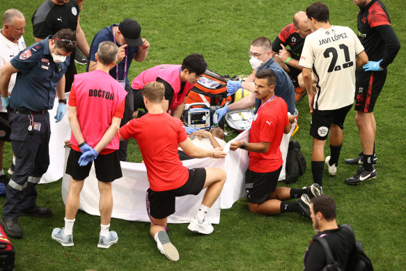 Adelaide’s Juande is treated after breaking his leg during the match between Melbourne City and Adelaide United at AAMI Park.