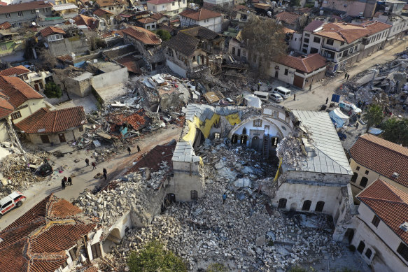 Turkish citizens pass next the historic Habib Najjar.