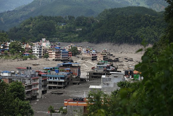 A flood-damaged section of a highway in Nuwakot, Central Nepal, following the outburst flood of a glacial lake in Tibet.