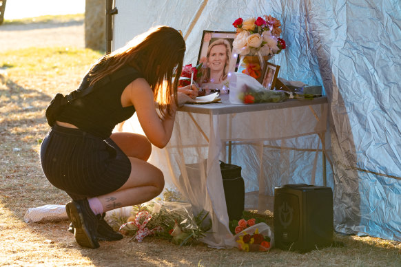 A woman signs a condolence book for Samantha Murphy in March.