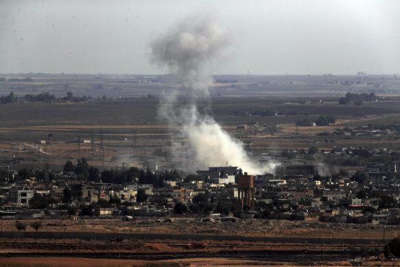 Smoke and dust billows from targets in Ras al-Ayn, Syria, caused by bombardment by Turkish forces.