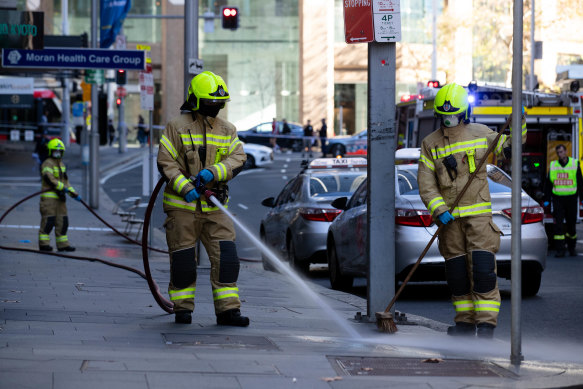 The footpath on Bridge Street where Bilal Hamze was shot is hosed down.