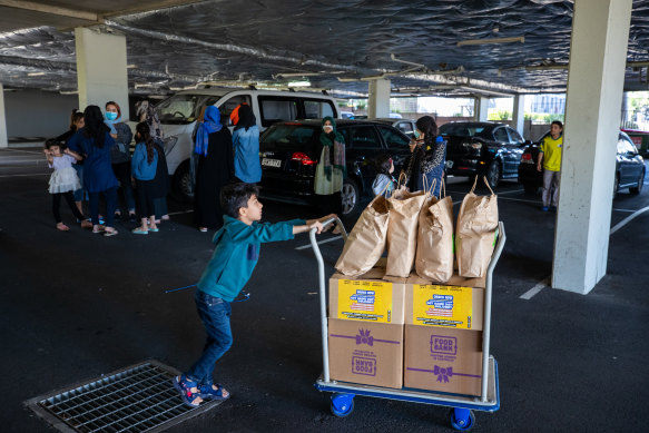 Refugees waiting for supplies. Afghan Peace Foundation are helping the Afghan refugees settle into living in Australia. 