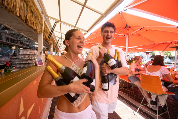 Arbory Afloat staff Bel O’Brien and Angus Fenton setting up the champagne before the celebrations begin.