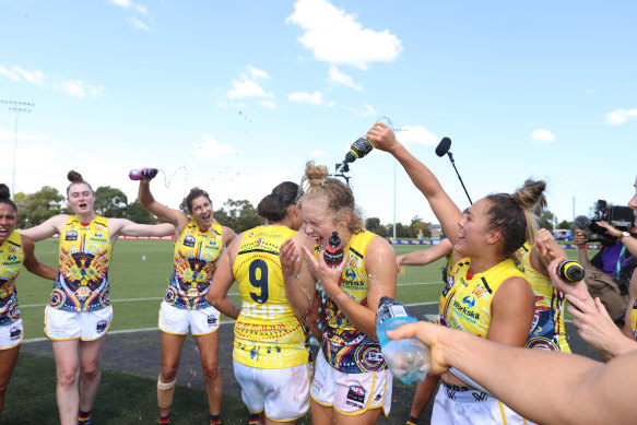 The Crows celebrate the minor premiership and their win over St Kilda.