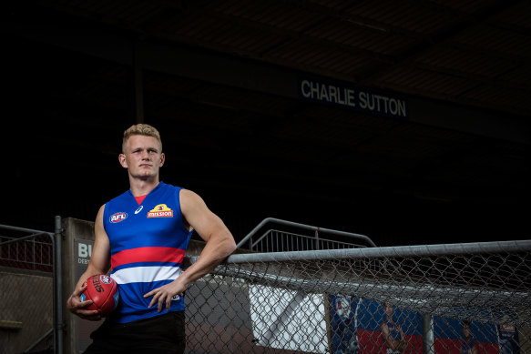 Adam Treloar poses in his new team  jersey. 