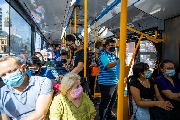 A packed bus heads west away from the CBD.