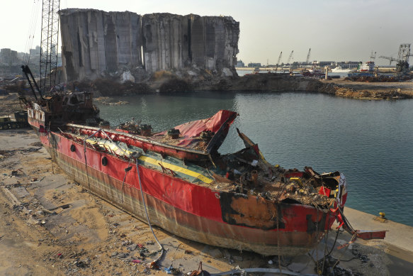 A destroyed ship lies near towering grain silos gutted in the massive August explosion.