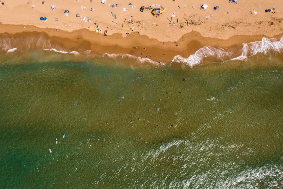 People escaping the heat by flocking to the beach are facing high tides. 
