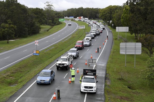 Vehicles arriving from New South Wales queuing to cross the Queensland border at Coolangatta in December. 