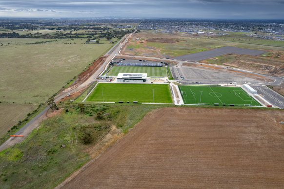 Three soccer pitches and a pavilion stand among the farms on the western fringe of Melbourne.