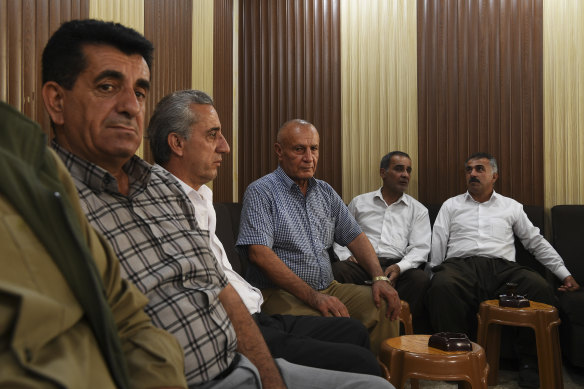Men discuss the war in Rojava - the name given to the Kurdish region in Syria - at a coffee shop in Duhok, Iraqi Kurdistan.