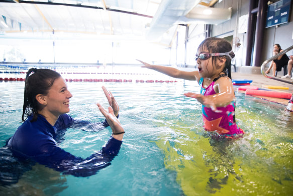 Swimming instructor Melinda with Kay-Li Khor, four, at the Vic Uni pool.