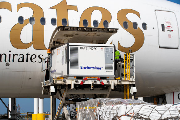 The first shipment of AstraZeneca COVID-19 vaccine is removed from the Emirates airlines plane at Sydney International airport on February 28.