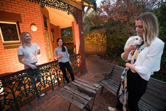 Melbourne housemates Brigid Davis, Maddy Ellis, Lizzie Turner - pictured with bunny Ralphy - have been brought closer during the COVID-19 crisis.