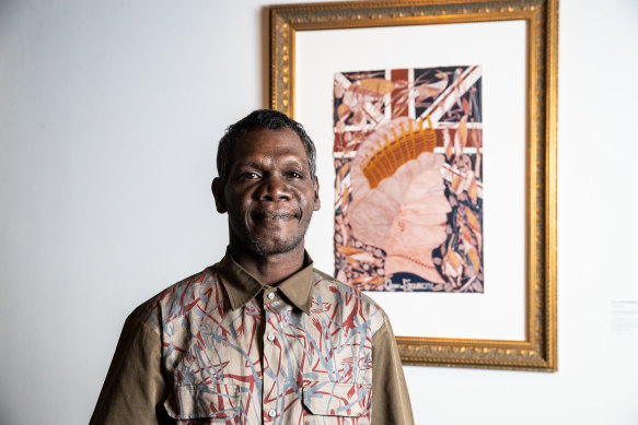 Winner of the Telstra Emerging Artist Award Titus Nganjmirra, with his portrait of the queen. 