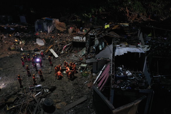 Rescuers search for victims of a landslide triggered by Typhoon Lekima in Yongjia county in eastern China's Zhejiang province on Saturday. 