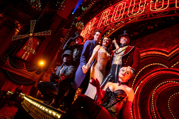 Moulin Rouge! cast pose on stage at the Regent.