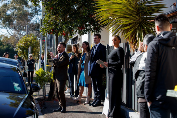 Auctioneer Thomas McGlynn prepares to sell the home at 34 Quirk Street, Rozelle.