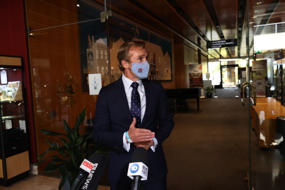 Rob Stokes emerges from the party room meeting.