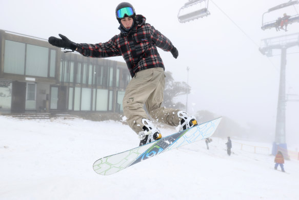 A snowboarder takes a jump at Mt Buller Ski Resort in June. 
