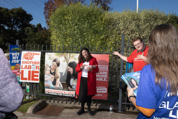 Garland handing out how-to-vote cards on election day.