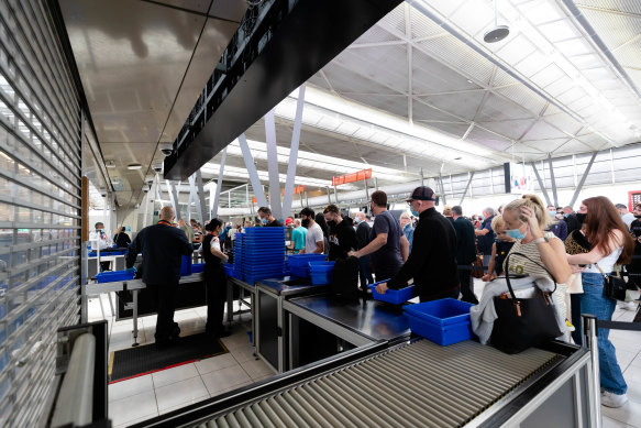 Shuttered security lanes during peak hour at Sydney Airport are causing a major bottleneck for passengers.