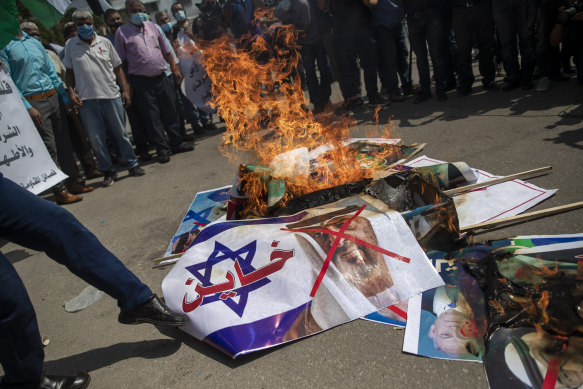 Palestinians in Gaza burn pictures of then US president Donald Trump, Israeli PM Benjamin Netanyahu, Bahrain King Hamad bin Isa al-Khalifa and Abu Dhabi Crown Prince Mohammed bin Zayed al-Nahyan, to protest the UAE and Bahraini normalisation pact with Israel in 2020.