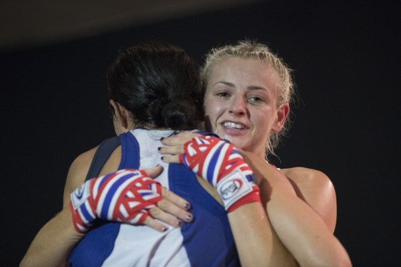 Holly Perdikaris embraces Kadee Hollis after their fight.