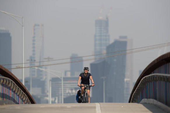 A cyclist rides across the Bolte Bridge on December 20.