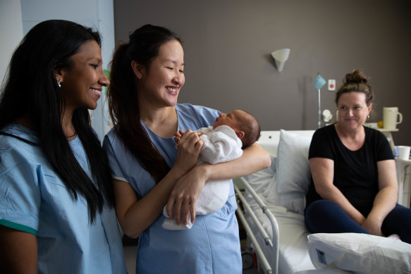 Obstetricians Kaushi Arulpragasam, left, and Stephanie Sii, right, with four-day-old Richie Hicks and his mum, Rhiannon, at the Royal Hospital for Women in Randwick.