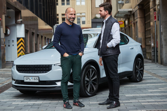 Uber chief executive Dara Khosrowshahi (left) speaks with Chris King, the chief executive of car finance firm Splend.