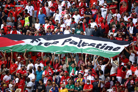 Fans hold a protest banner during Tunisia v Australia at Al Janoub Stadium in Al Wakrah, Qatar, o Saturday.