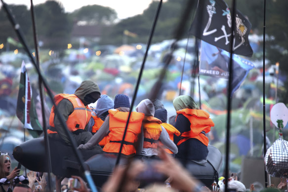 Banksy launched an inflatable migrant boat into the crowd during Idles’ set.