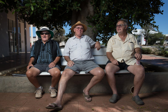 Bill Howlett, Chris Boucher, and Pete Rogers on Cobar's main street. They are speaking out about the local hospital despite concerns about ruffling feathers in the tight-knit community. 