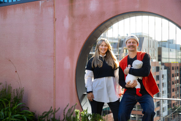 Tessa Carroll and Ben Heenan, pictured with baby Anderson, make sustainable clothing.