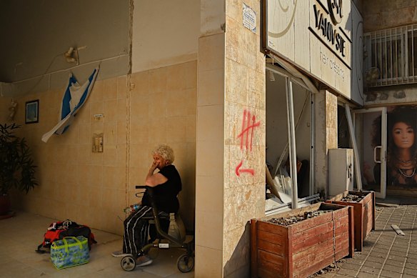 A resident of a flats of flats that has been struck by an iranian ballistic missile in beersheba on Tuesday.