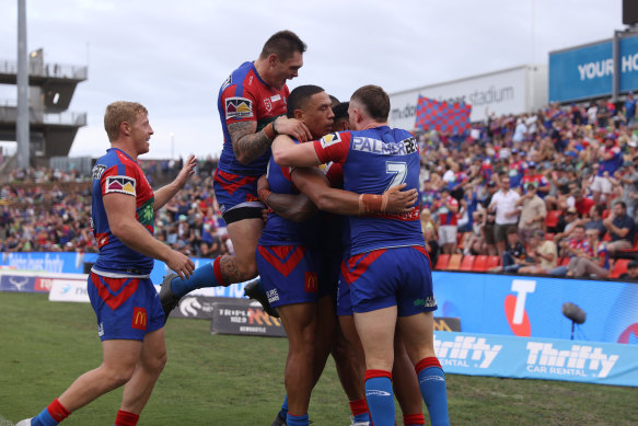 The Knights celebrate Dane Gagai’s try in front of their home fans.