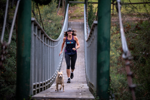Good day for a run: Rosie Spicer braves the cold to train in Porepunkah with her dog, Noah.