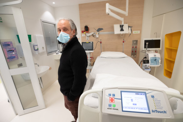 Monash Health chief executive Andrew Stripp inspects a bed in his hospital’s new COVID ward.