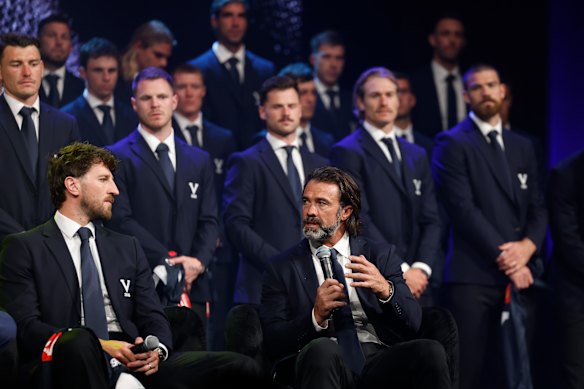 Chris Scott surrounded by his star-studded Victorian line-up.