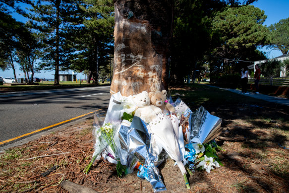 Flowers and toys left at the crash site on The Grand Parade in Monterey.