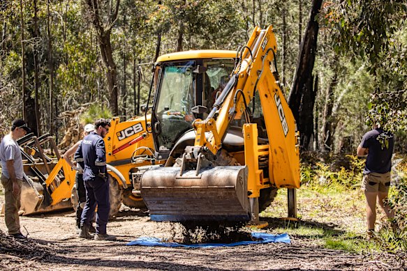 Earthmoving equipment arrives to help in the search for Russell Hill and Carol Clay.
