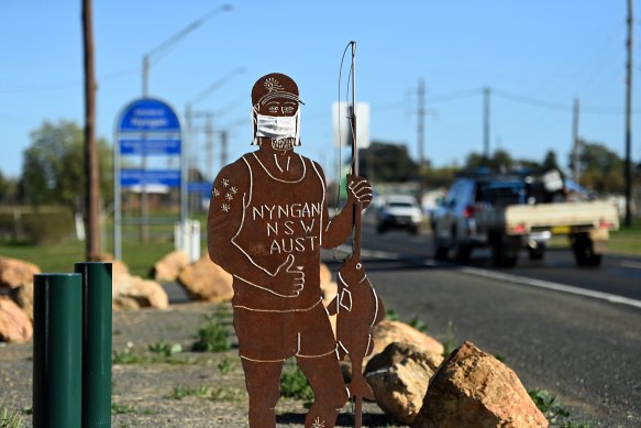 A statue wearing a face mask at the entrance to Nyngan in western NSW.