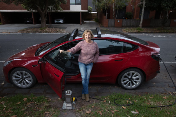Debra Sykes with a charging station by her home in St Kilda. 