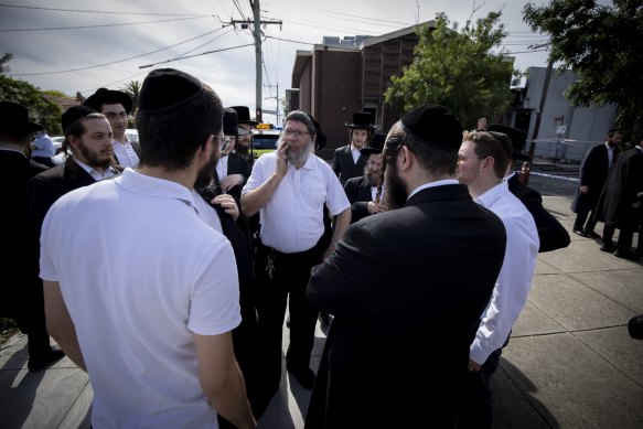 Yumi Friedman (centre) was inside the synagogue when the building was firebombed.