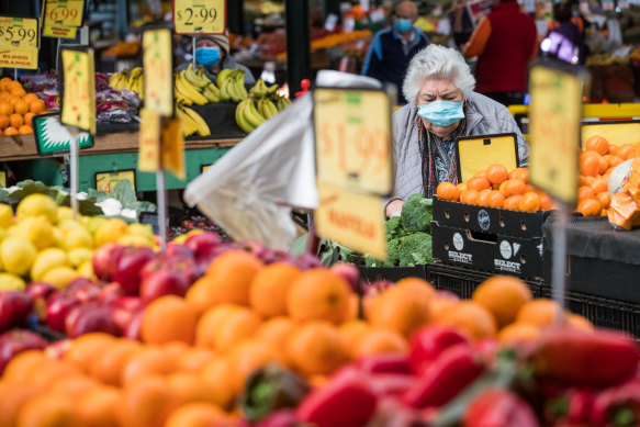 Shoppers at Preston Market in July.