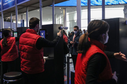 Attendees use facial recognition at a trade show in Barcelona, February 2022.
