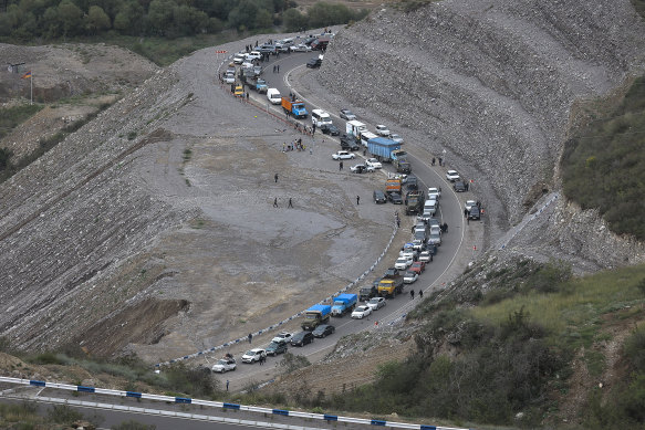 A convoy of cars of ethnic Armenians from Nagorno-Karabakh fleeing their homes.